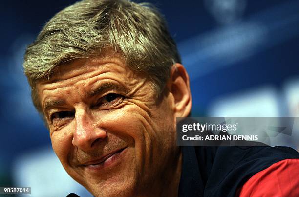 Arsenal's Manager Arsene Wenger smiles while answering a question during a press conference at Camp Nou stadium in Barcelona April 5, 2010. Arsenal...