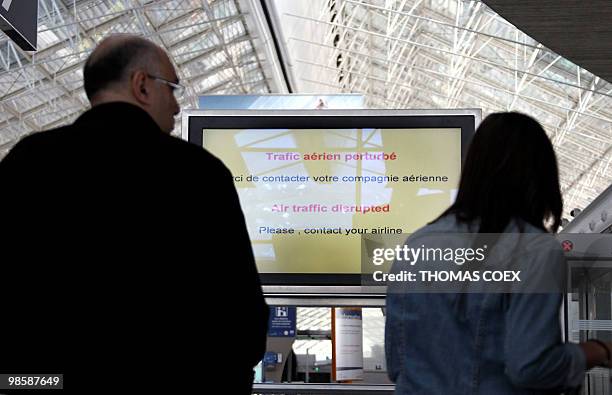 Passengers wait inside the Roissy Charles de Gaulle Airport outside Paris, on April 16, 2010. French aviation authorities ordered airports in Paris...