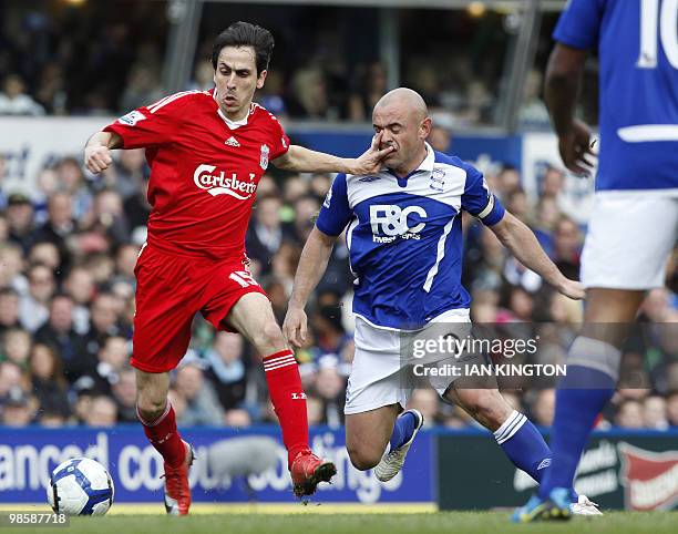 Liverpool's Israeli player Yossi Benayoun vies for the ball with Birmingham City's Irish footballer Stephen Carr during a Premier League match at St...