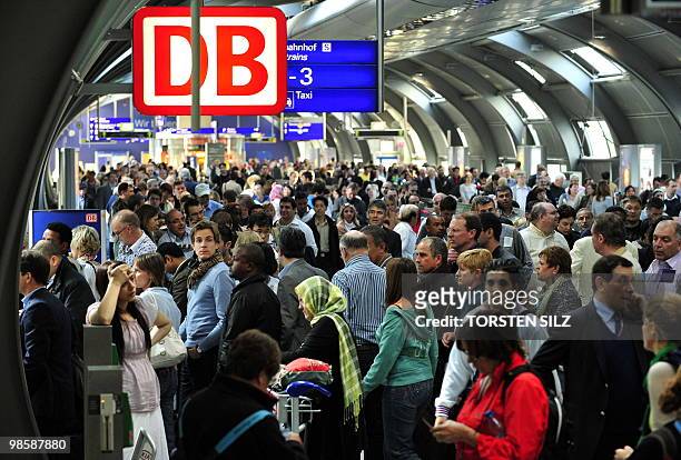 Flight passengers crowd in front of the ticket desk of German railway company Deutsche Bahn on April 16, 2010 at the airport in Frankfurt/M. Many...