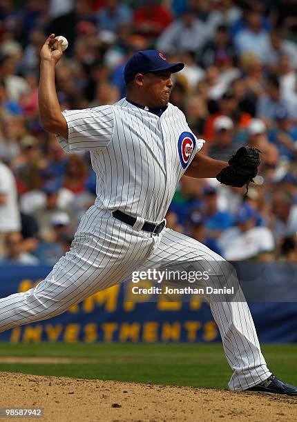 Starting pitcher Carlos Zambrano of the Chicago Cubs, wearing a number 42 jersey in honor of Jackie Robinson, delivers the ball against the Milwaukee...