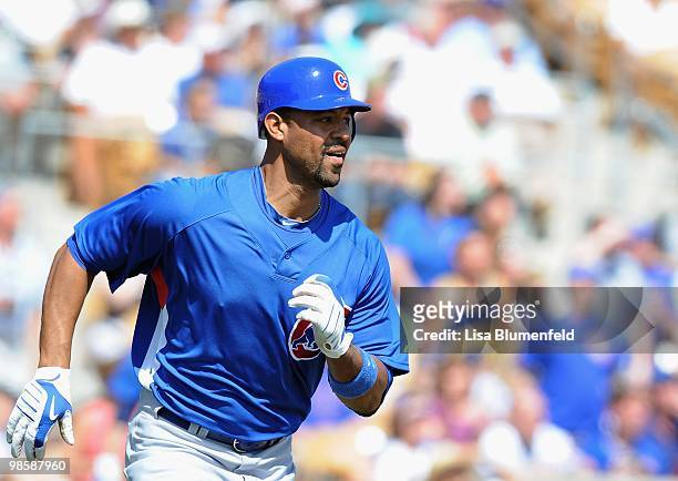 Derek Lee of the Chicago Cubs runs to first base during a Spring Training game against the Chicago White Sox on March 19, 2010 at The Ballpark at...