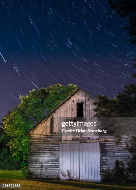 barn star trails - rustic star stock-fotos und bilder