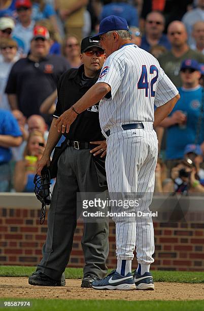 Manager Lou Piniella of the Chicago Cubs, wearing a number 42 jersey in honor of Jackie Robinson, argues with home plate umpire Angel Campos after...