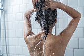 Asian women bathing and she was bathing and washing hair.she is happy