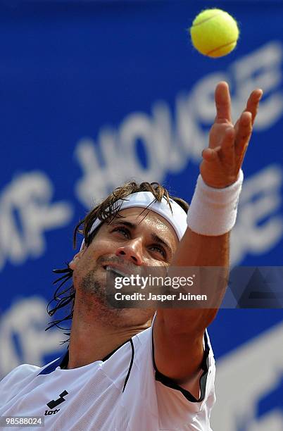 David Ferrer of Spain serves the ball to his fellow countryman Marcel Granollers on day three of the ATP 500 World Tour Barcelona Open Banco Sabadell...