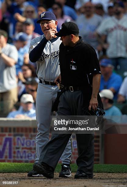 Manager Ken Macha of the Milwaukee Brewers, wearing a number 42 jersey in honor of Jackie Robinson, argues with home plate umpire Angel Campos during...