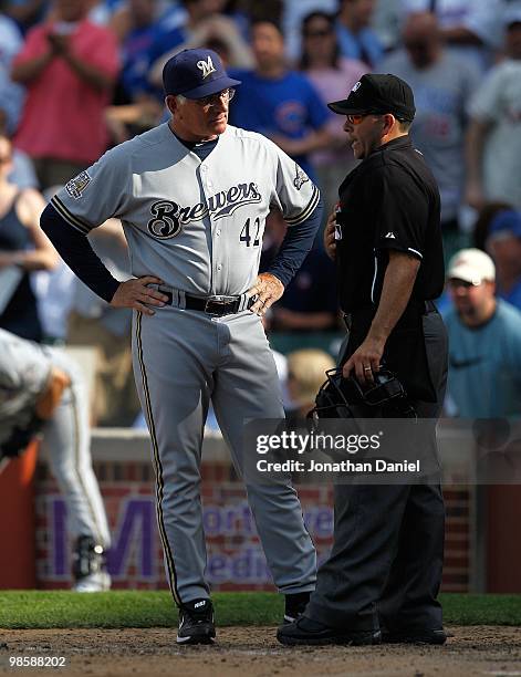 Manager Ken Macha of the Milwaukee Brewers, wearing a number 42 jersey in honor of Jackie Robinson, argues with home plate umpire Angel Campos during...