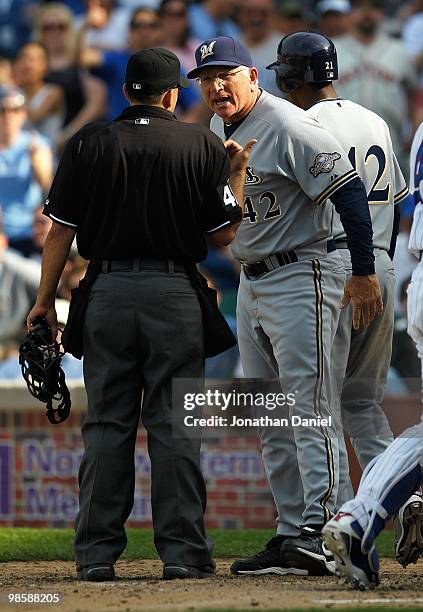 Manager Ken Macha of the Milwaukee Brewers, wearing a number 42 jersey in honor of Jackie Robinson, argues with home plate umpire Angel Campos during...