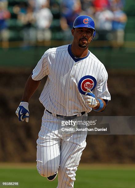 Derrek Lee of the Chicago Cubs, wearing a number 42 jersey in honor of Jackie Robinson, runs the bases after hitting a home run in the 1st inning...