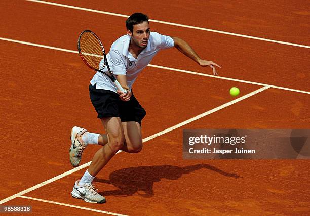 Marcel Granollers of Spain runs to return a backhand to his fellow countryman David Ferrer on day three of the ATP 500 World Tour Barcelona Open...