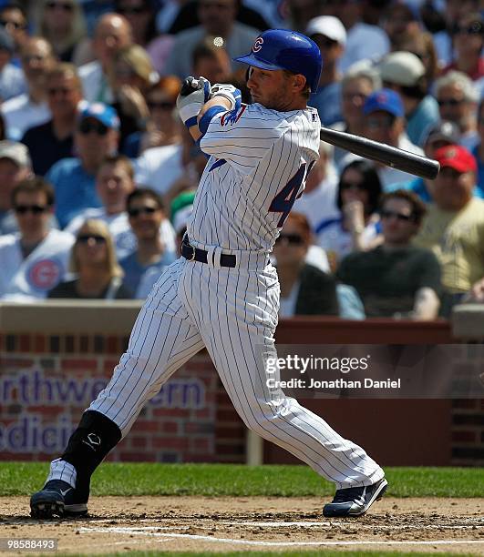 Mike Fontenot of the Chicago Cubs, wearing a number 42 jersey in honor of Jackie Robinson, takes a swing against the Milwaukee Brewers at Wrigley...