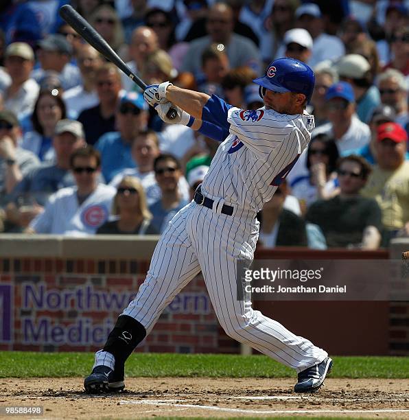 Mike Fontenot of the Chicago Cubs, wearing a number 42 jersey in honor of Jackie Robinson, takes a swing against the Milwaukee Brewers at Wrigley...