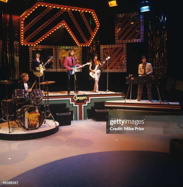 Derek Longmuir, Eric Faulkner, Duncan Faure, Stuart Wood and Alan Longmuir of the Bay City Rollers perform on 'Cheggers Plays Pop' television show...