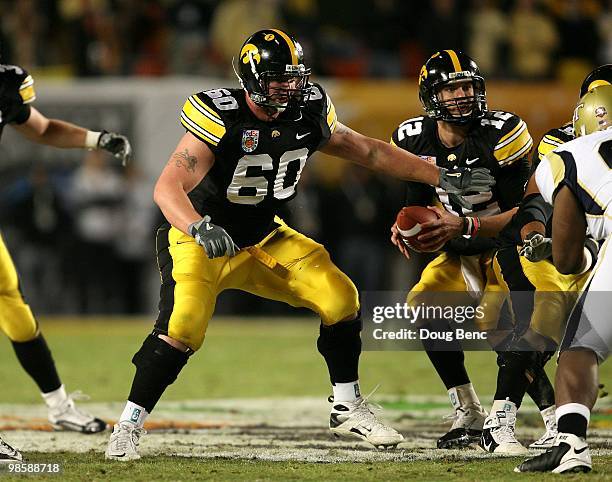 Offensive guard Kyle Calloway of the Iowa Hawkeyes pass blocks for quarterback Ricky Stanzi against the Georgia Tech Yellow Jackets during the FedEx...