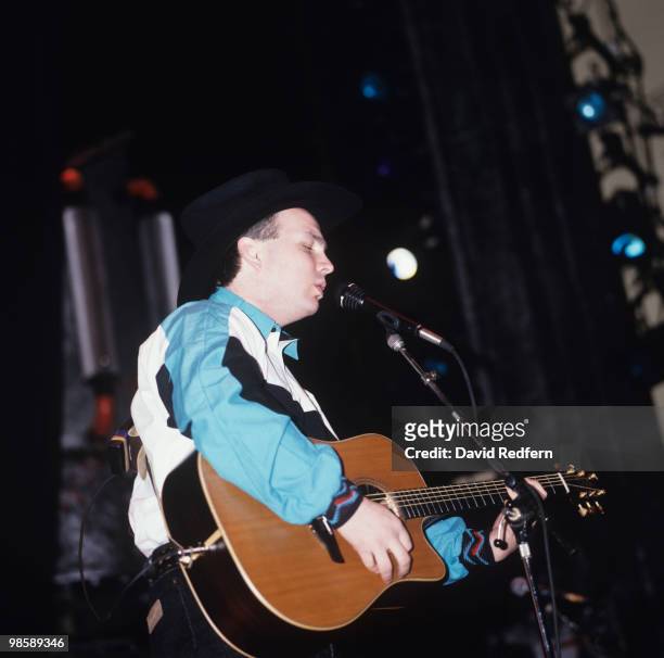 American country singer Garth Brooks performs on stage in 1991.