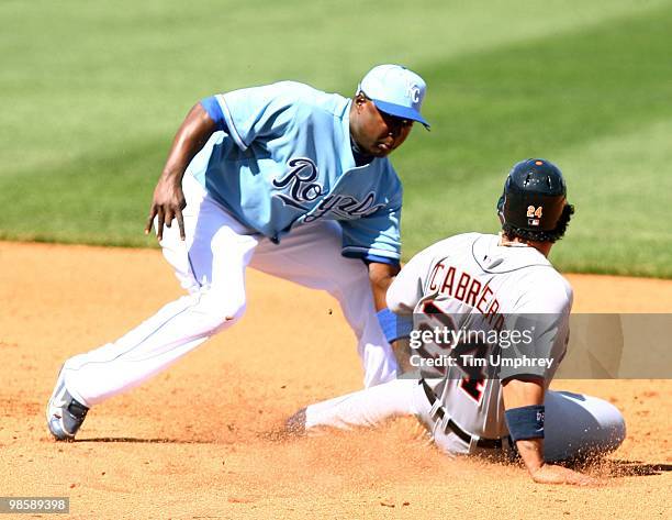 Shortstop Yuniesky Betancourt of the Kansas City Royals tags Miguel Cabrera of the Detroit Tigers in a game on April 8, 2010 at Kauffman Stadium in...