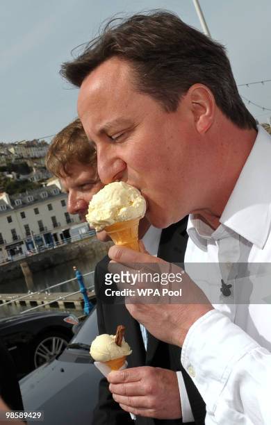 Conservative leader David Cameron eats an ice cream during a walka bout on April 21, 2010 in Torquay, United Kingdom. The General Election, to be...
