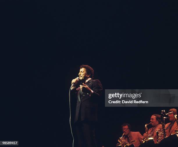 American singer Tony Bennett performs on stage circa 1975.