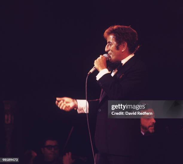 American singer Tony Bennett performs on stage at the Palladium in London, England in 1976.