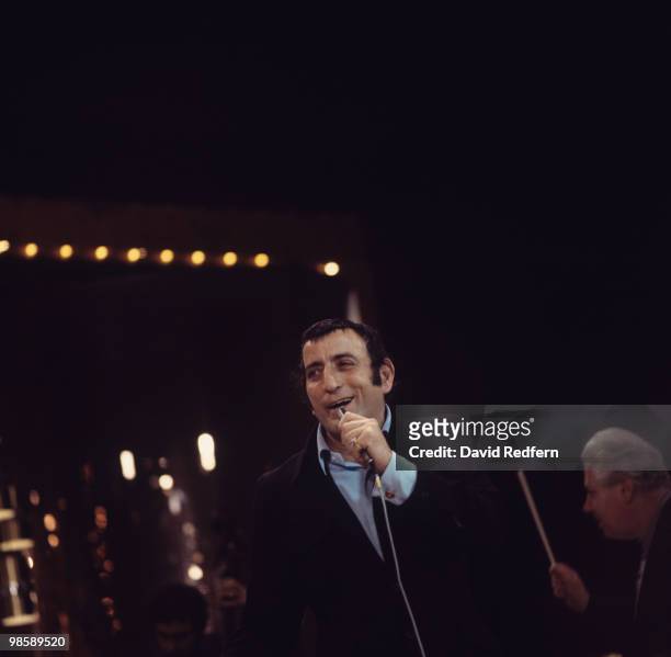 American singer Tony Bennett performs on stage circa 1970.