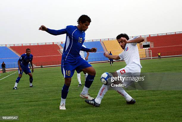 Tamer Mohammad Hanash of Yemen's Al-Hilal competes with Kuwait club's Fahd Shahine during their 2010 AFC Cup Group B football match in Sanaa, Yemen...