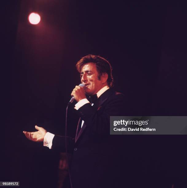 American singer Tony Bennett performs on stage at the Palladium in London, England in 1976.