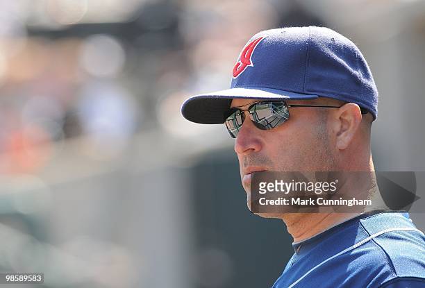 Manny Acta of the Cleveland Indians looks on from the dugout against the Detroit Tigers during the game at Comerica Park on April 10, 2010 in...