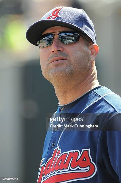 Manny Acta of the Cleveland Indians looks on from the dugout against the Detroit Tigers during the game at Comerica Park on April 10, 2010 in...