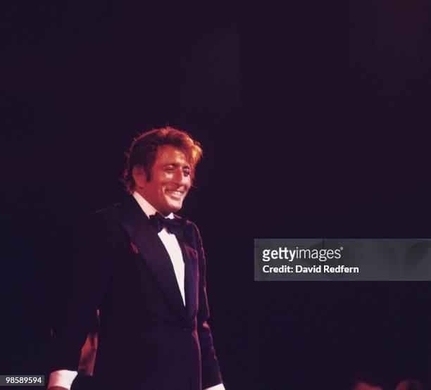 American singer Tony Bennett performs on stage at the Palladium in London, England in 1976.