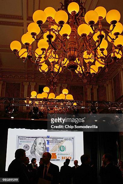 Journalists and government officials attend the unveiling of the new $100 note at the Treasury Department April 21, 2010 in Washington, DC. According...