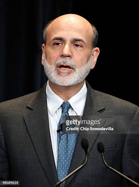 Federal Reserve Chairman Ben Bernanke makes brief remarks during the unveiling of the new $100 note in the Cash Room at the Treasury Department April...