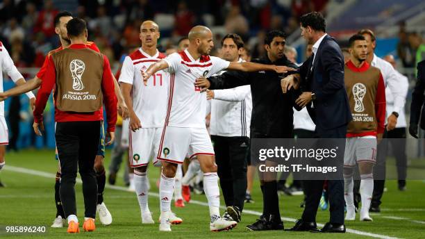 Karim El Ahmadi of Morocco and Head coach Fernando Hierro of Spain argue during the 2018 FIFA World Cup Russia group B match between Spain and...