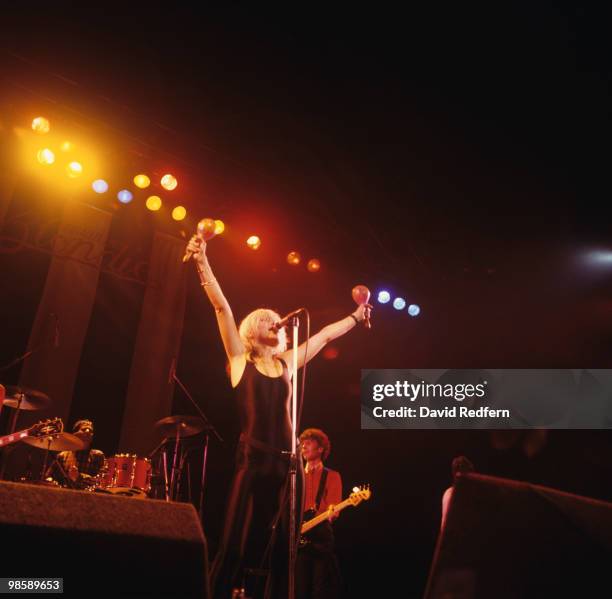 Drummer Clem Burke, singer Debbie Harry and bassist Nigel Harrison of Blondie perform on stage at the Hammersmith Odeon in London, England on...