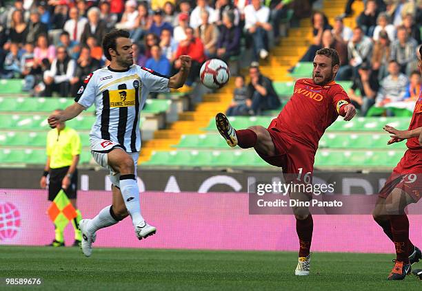 Paolo Sammarco of Udinese competes with Daniele De Rossi of Roma during the Tim Cup between Udinese Calcio and AS Roma at Stadio Friuli on April 21,...