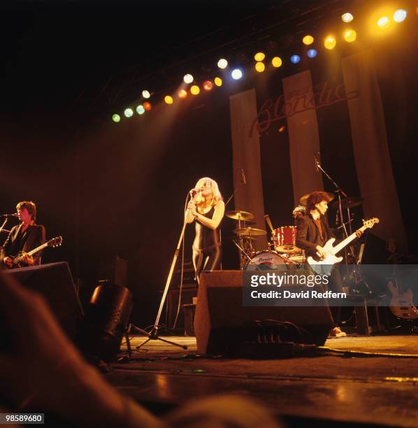 Guitarist Frank Infante, singer Debbie Harry and bassist Nigel Harrison of Blondie perform on stage at the Hammersmith Odeon in London, England on...