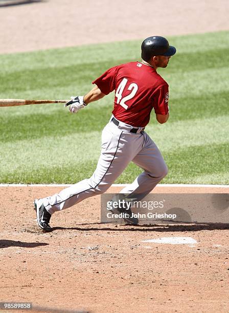 Pedro Feliz of the Houston Astros hits a RBI double in the top of the eighth inning to score the Astros' fifth run during the game against the St....