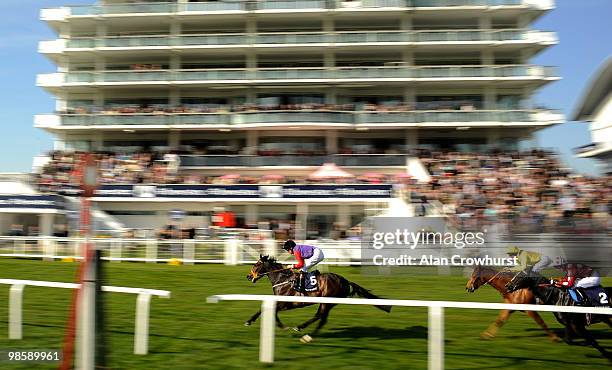 Quick Reaction and Richard Hughes win The Investec Specialist Private Bank maiden Stakes at Epsom racecourse on April 21, 2010 in Epsom, England