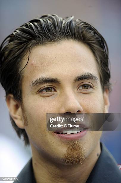 Apolo Anton Ohno talks to players before the game between the Colorado Rockies and the Washington Nationals April 20, 2010 at Nationals Park in...