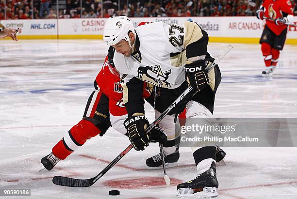 Craig Adams of the Pittsburgh Penguins battles Mike Fisher of the Ottawa Senators for the puck during Game 3 of the Eastern Conference Quaterfinals...