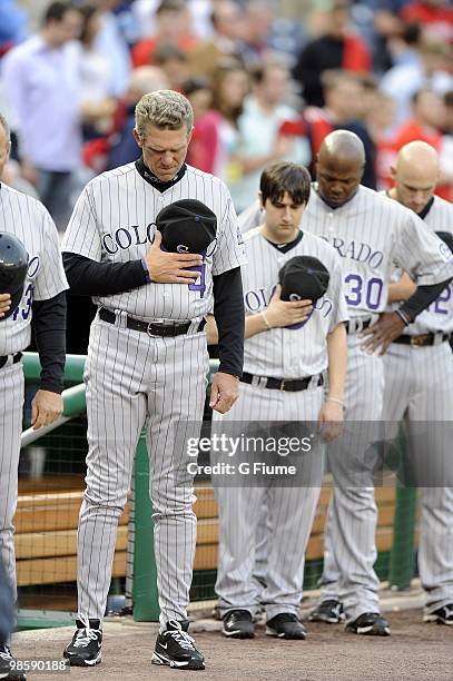 Manager Jim Tracy of the Colorado Rockies observes a moment of silence in honor of Rockies President Keli McGregor before the game against the...