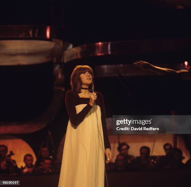 Singer Cilla Black performs on stage in the 1970's.