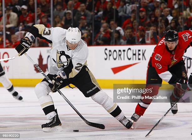 Alexei Ponikarovsky of the Pittsburgh Penguins skates with the puck against Jason Spezza of the Ottawa Senators during Game 3 of the Eastern...