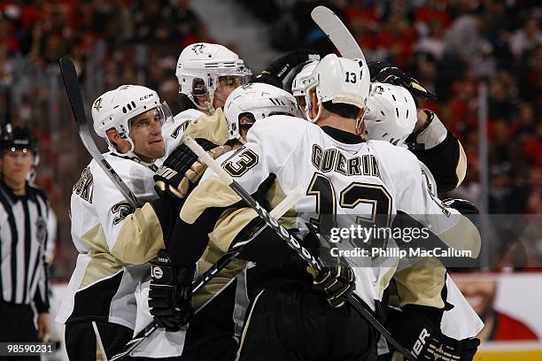 Alex Goligoski, Evgeni Malkin, Sidney Crosby, Bill Guerin and Chris Kunitz of the Pittsburgh Penguins celebrate against the Ottawa Senators during...