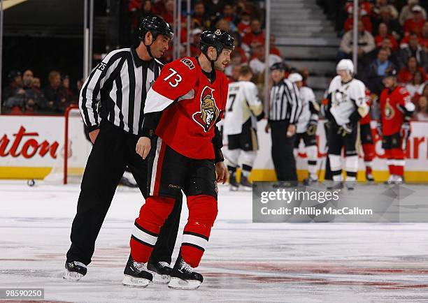 Jarkko Ruutu of the Ottawa Senators is escorted off the ice by Linesman Derek Amell in Game 3 of the Eastern Conference Quaterfinals against the...