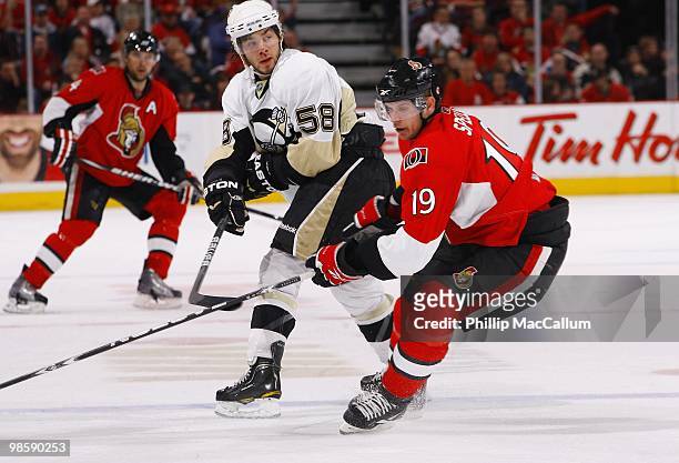 Jason Spezza of the Ottawa Senators skates against Kris Letang of the Pittsburgh Penguins during Game 3 of the Eastern Conference Quaterfinals during...