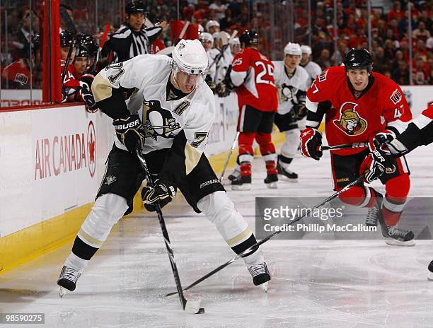Evgeni Malkin of the Pittsburgh Penguins skates with the puck against the Ottawa Senators during Game 3 of the Eastern Conference Quaterfinals during...