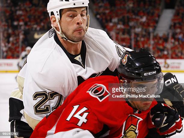 Chris Campoli of the Ottawa Senators battles for the puck against Craig Adams of the Pittsburgh Penguins during Game 3 of the Eastern Conference...