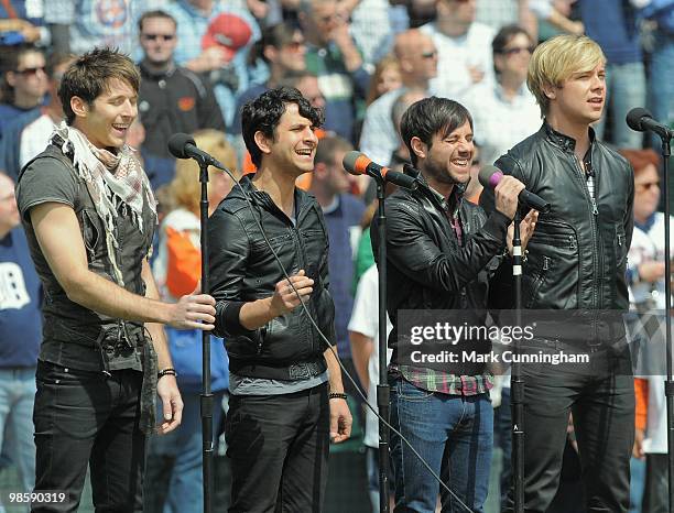 Alexander Noyes, Jason Rosen, Michael Bruno and Andrew Lee of Honor Society perform the National Anthem before the baseball game between the Detroit...