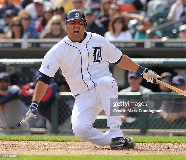 Gerald Laird of the Detroit Tigers reacts to fouling a baseball off of his leg against the Cleveland Indians during the game at Comerica Park on...